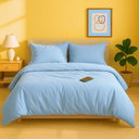housse de couette zippée percale de coton avec des coussins sur un lit dans une chambre moderne.